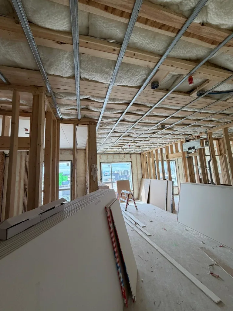Commercial curved ceiling panel installation using scissor lift